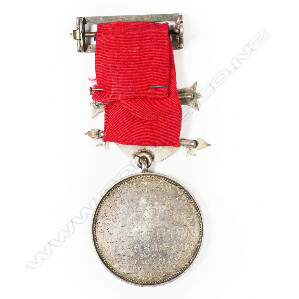 Anton Teutenberg UFBA medal to Benjamin Hounslow - with his name on the medal suspender and bar, contained in box of issue. The medal named to Benjamin Hounslow from the Masterton Fire Brigade 1880. Benjamin was a cabinetmaker who died at Masterton 1893 aged 32/3. The medal is an excellent early example of Teutenberg's work and has been hand engraved by him. Image 1++