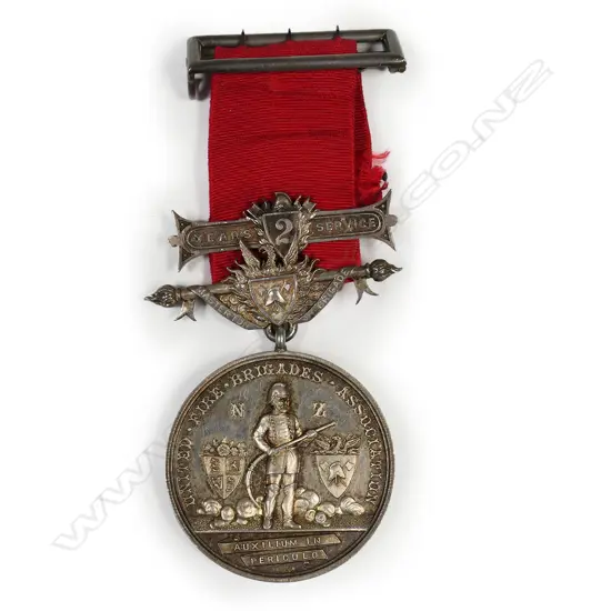 Anton Teutenberg UFBA medal to Benjamin Hounslow - with his name on the medal suspender and bar, contained in box of issue. The medal named to Benjamin Hounslow from the Masterton Fire Brigade 1880. Benjamin was a cabinetmaker who died at Masterton 1893 aged 32/3. The medal is an excellent early example of Teutenberg's work and has been hand engraved by him.