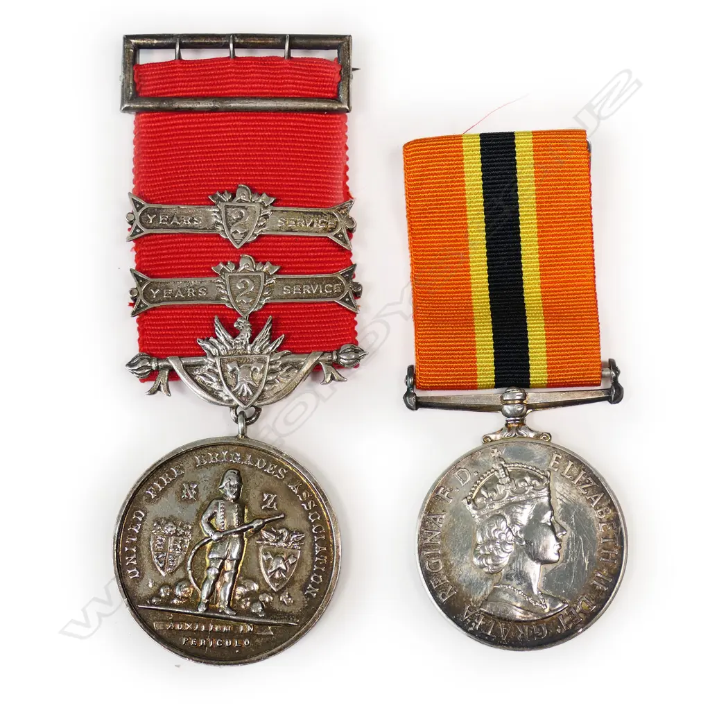 An interesting NZ Fire Brigade Long Service Medal - to R O Hilton of Christchurch, together with his UFBA Medal with 4 bars (2 fitted), this dated 1980. Image 1++