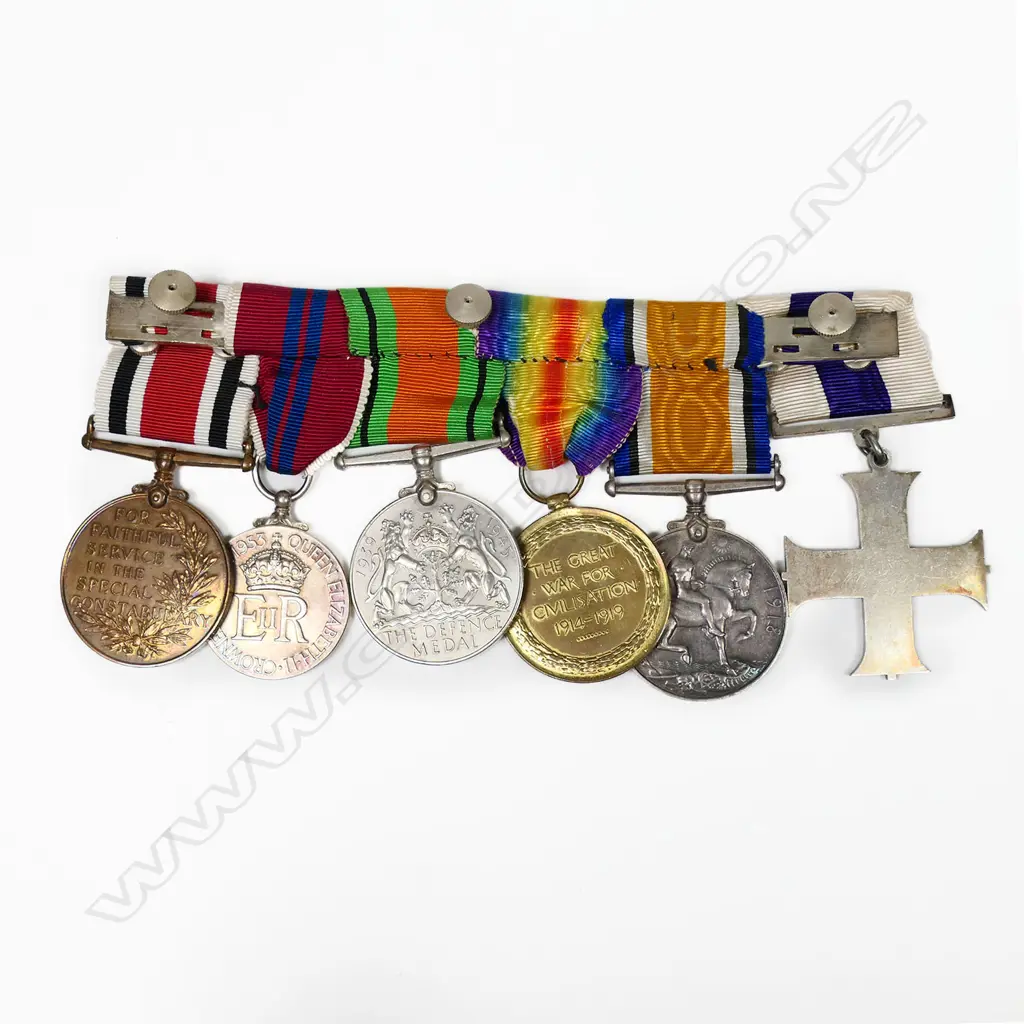 The medal group awarded to Lt. E.D. Cox R.F.A. including the Military Cross - the Military Cross with original box, together with WWI Pair, named to Lt. E.D. Cox, The Defence Medal and the 1953 Coronation medal. The group also with Special Constabulary Long Service Medal awarded to Lt. E.D. Cox's brother Keith T. Cox and named to him. Image 1++