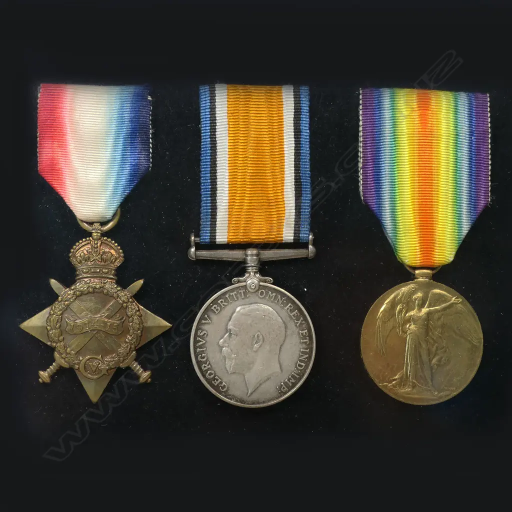 WW1 1914-15 trio of medals in a modern frame - with copy photo and 2 wound stripes. The medals all correctly impressed 10/409 SJT L A KINZETT NZEF. Louis Kinzett was living in Wanganui working as a wood turner when he enlisted in the Wellington Infantry in October 1914. He served at Gallipoli where he was wounded on 5 May 1915. He is known to have been involved in a brutal bayonet charge earlier. After recovery in Egypt he was returned to Gallipoli 3 months later, narrowly missing his Battalions near obliteration at Chunuk Bair on 8 August. His second wounding was in France on 15 September 1916. Image 1++