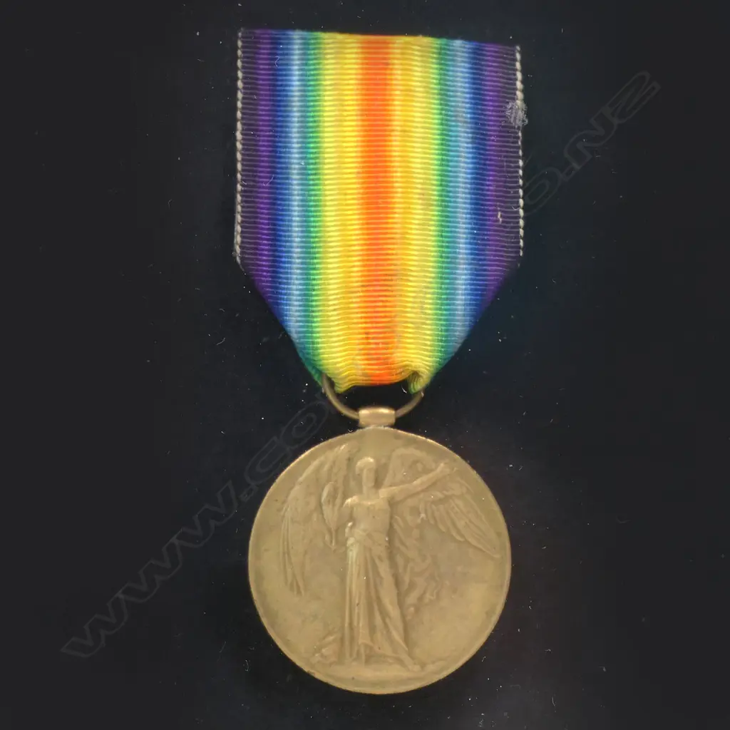 1914-19 Victory Medal in modern frame with copy photo - the medal impressed 10/273 PTE H E M BROOME NZEF. Harry Broome from Whanganui was a young lawyer serving in the Wellington West Coast Company of the Wellington Infantry. He was killed at Helles on 10 May 1915 aged 20. Image 1++