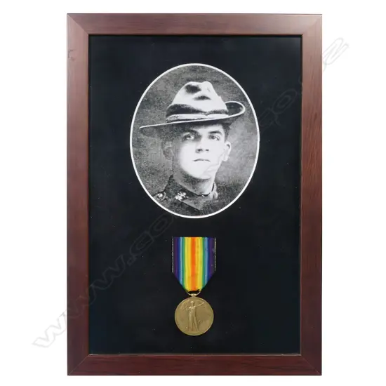 1914-19 Victory Medal in modern frame with copy photo - the medal impressed 10/273 PTE H E M BROOME NZEF. Harry Broome from Whanganui was a young lawyer serving in the Wellington West Coast Company of the Wellington Infantry. He was killed at Helles on 10 May 1915 aged 20.