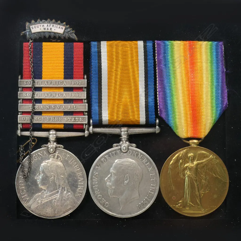 The Boer War and WW1 Medals to Charles Kelland - of the Canterbury Infantry. Killed with the Trench Mortars, on the Somme 28 April 1918. Charles Kelland served in the Boer War with the 7th NZ Contingent. His QSA is named 4418 PTE C C KELLAND 7TH NZ CONT. His WW1 pair is named 27307 PTE C C KELLAND NZEF. Mounted in modern frame with small NZ Boer War veterans fern leaf badge and copy photo. Image 1++