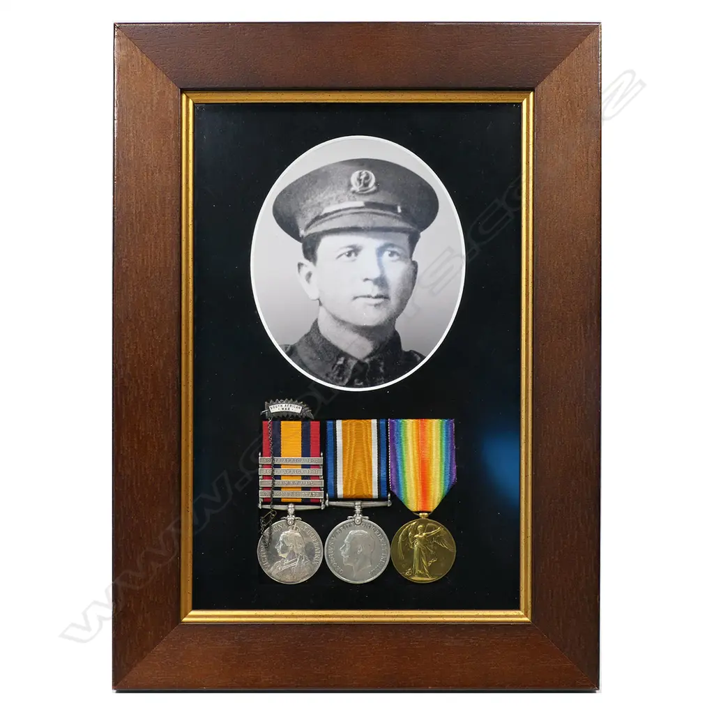 The Boer War and WW1 Medals to Charles Kelland - of the Canterbury Infantry. Killed with the Trench Mortars, on the Somme 28 April 1918. Charles Kelland served in the Boer War with the 7th NZ Contingent. His QSA is named 4418 PTE C C KELLAND 7TH NZ CONT. His WW1 pair is named 27307 PTE C C KELLAND NZEF. Mounted in modern frame with small NZ Boer War veterans fern leaf badge and copy photo. Image 1++