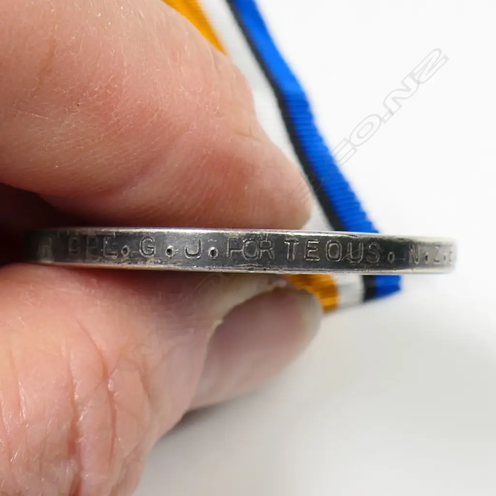 1914-18 War medal to 16120 (T) CPL G J PORTEOUS NZEF - he served in the Canterbury Mounted Rifles in Sinai and Palestine and then the conclusion of the war formed part of the occupation force which served in Turkey and returned to Gallipoli in November 1918 to bury the dead. Quite rare as such. Sold with his elaborately engraved gold fob from the town he was from. This is 9ct and weighs 6.9gms. Image 1++