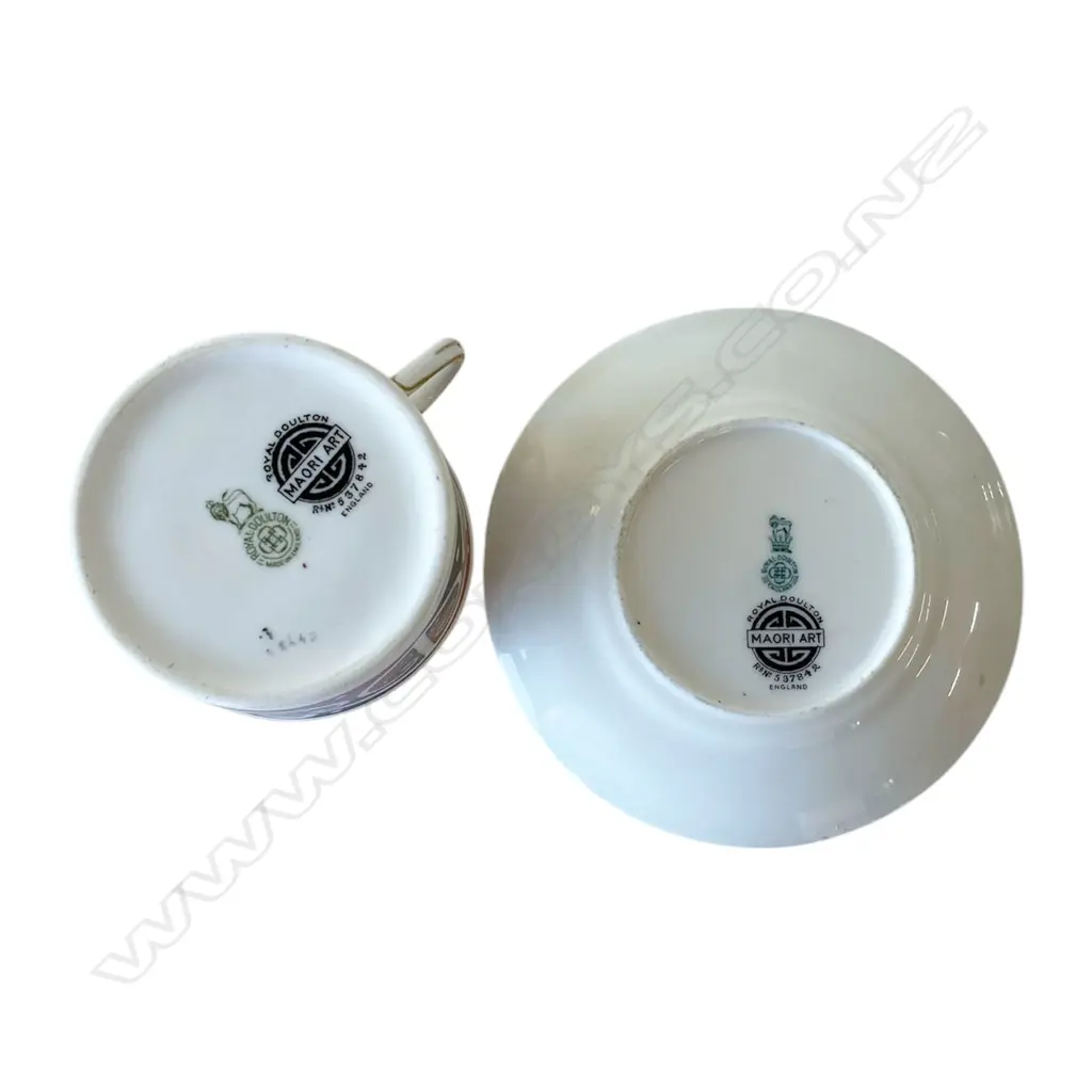 A Royal Doulton 'Māori Art' eight-person porcelain tea service - comprising eight coffee cups, eight saucers, eight side plates and one cake plate. Decorated in a Māori kowhaiwhai rafter design adapted by Augustus Hamilton for Royal Doulton. Image 1++