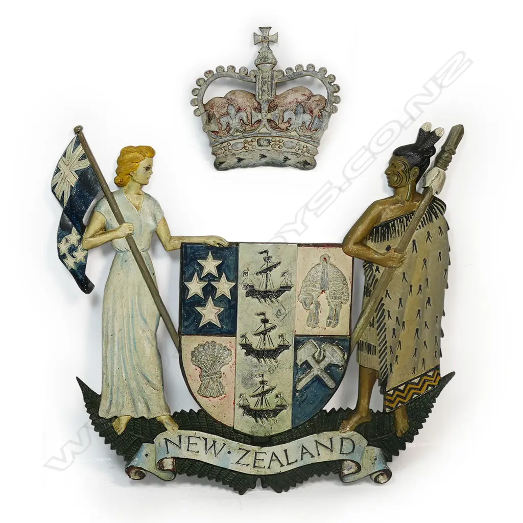 A vintage painted heavy cast bronze New Zealand Coat of Arms - the design reflects New Zealand's history as a bicultural nation, with Zealandia, a European female figure on one side and a Māori Rangatira (chief) on the other. The symbols on the central shield represent New Zealand's trade, agriculture and industry, and a Crown represents New Zealand's status as a constitutional monarchy. 610 x 590mm. Image 1++