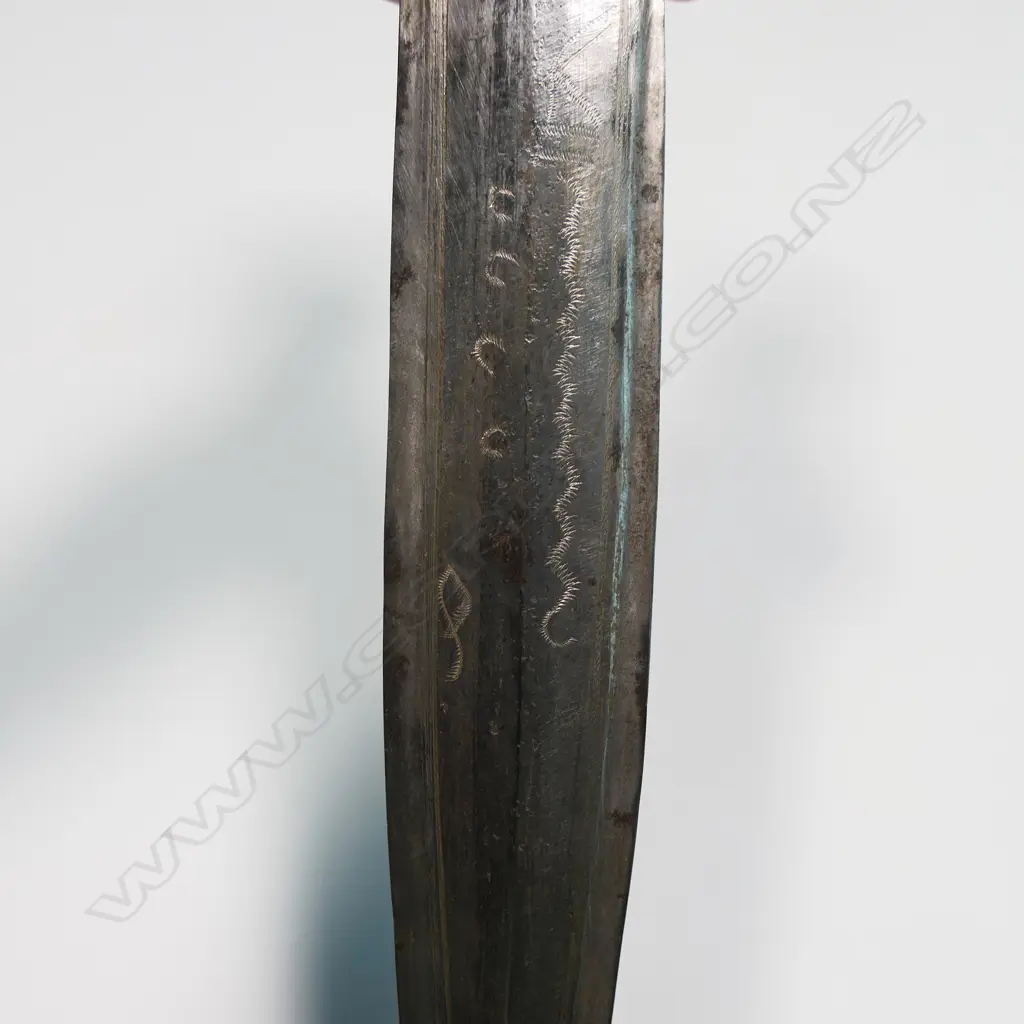 An African dagger - stitched leather scabbard and carved wood handle, straight double edge blade with fine etched cross hatched engraving. L.390mm. Image 1++