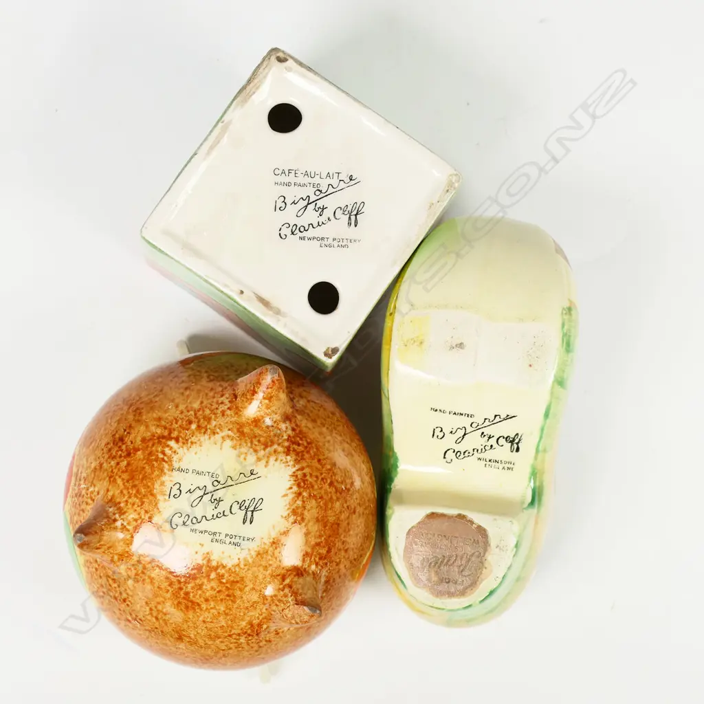 Three Clarice Cliff Bizarre pieces - cube inkwell (no lid), Rodanthe pattern clog or sabot in the Viscaria colourway L.105mm. Together with a Nasturtium pattern cauldron H.73mm. Image 1++