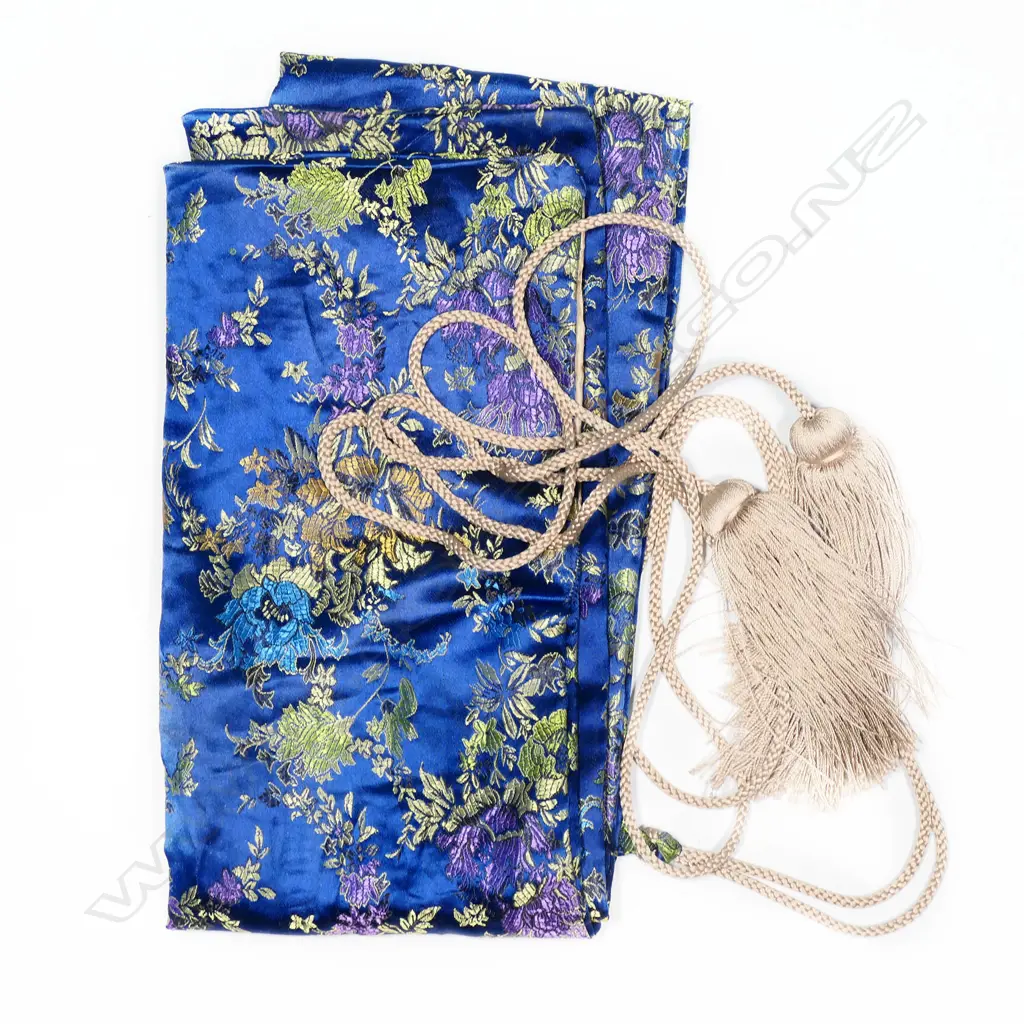 A fine old Japanese katana - possibly 16thC Mino school, unsigned, original polish with healthy undulating gunome temper, no flaws to the blade. Old mounts with Fuchi and Kojiri in dark Shibuichi carved with waves and gold highlights. Menuki of Shakudo and gold in floral design. The iron Tsuba in open design with samurai figures by a bridge. Quality black lacquer saya with maroon Sageo and fine blue/gold silk bag. L. 900mm. Image 1++