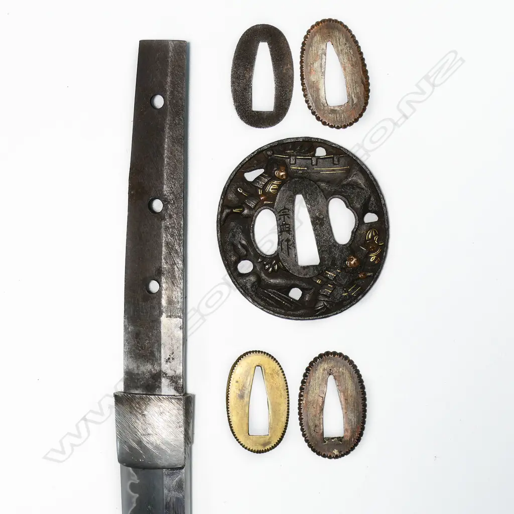 A fine old Japanese katana - possibly 16thC Mino school, unsigned, original polish with healthy undulating gunome temper, no flaws to the blade. Old mounts with Fuchi and Kojiri in dark Shibuichi carved with waves and gold highlights. Menuki of Shakudo and gold in floral design. The iron Tsuba in open design with samurai figures by a bridge. Quality black lacquer saya with maroon Sageo and fine blue/gold silk bag. L. 900mm. Image 1++