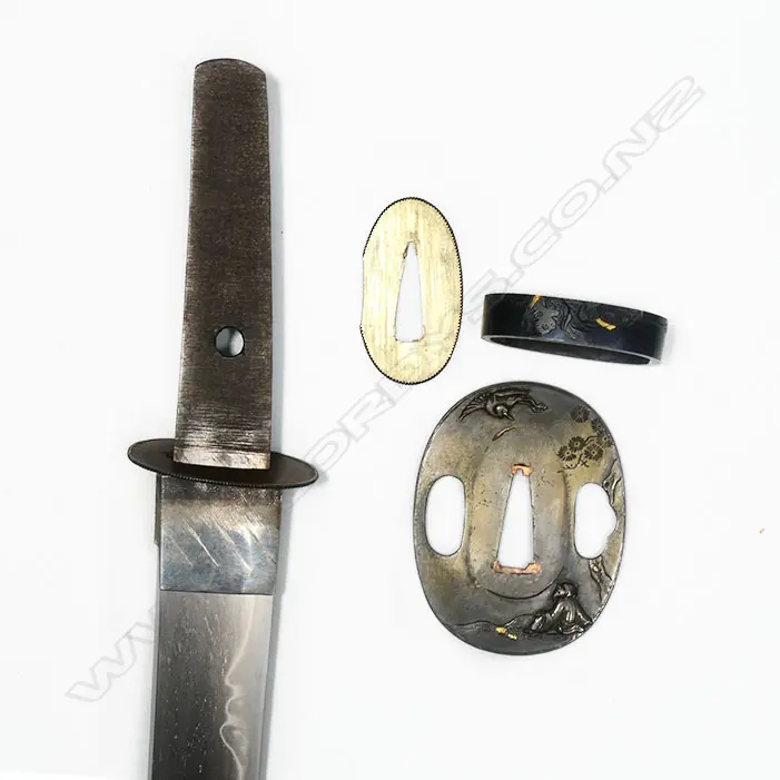 A Japanese late 18th/early 19thC tanto - unsigned Hirazukuri blade in good polish with midare temper. Nice old mounts in excellent condition. Shakudo Tsuba, Fuchi Kashera with heron and figure with gold highlights, Shakudo double horse menuki. Fine black lacquer Saya with sash cord. Original old sword silk bag showing wear. L.530mm. Image 1++