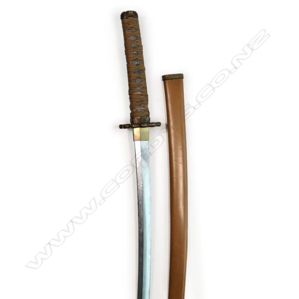 An uncommon small scale version of a Japanese katana, made for the Boy's Day ceremony - 455mm blade, the tang with two holes and threaded end; the hilt with correct scaled fittings and binding, in plain wood scabbard. Overall 630mm, Image 1++