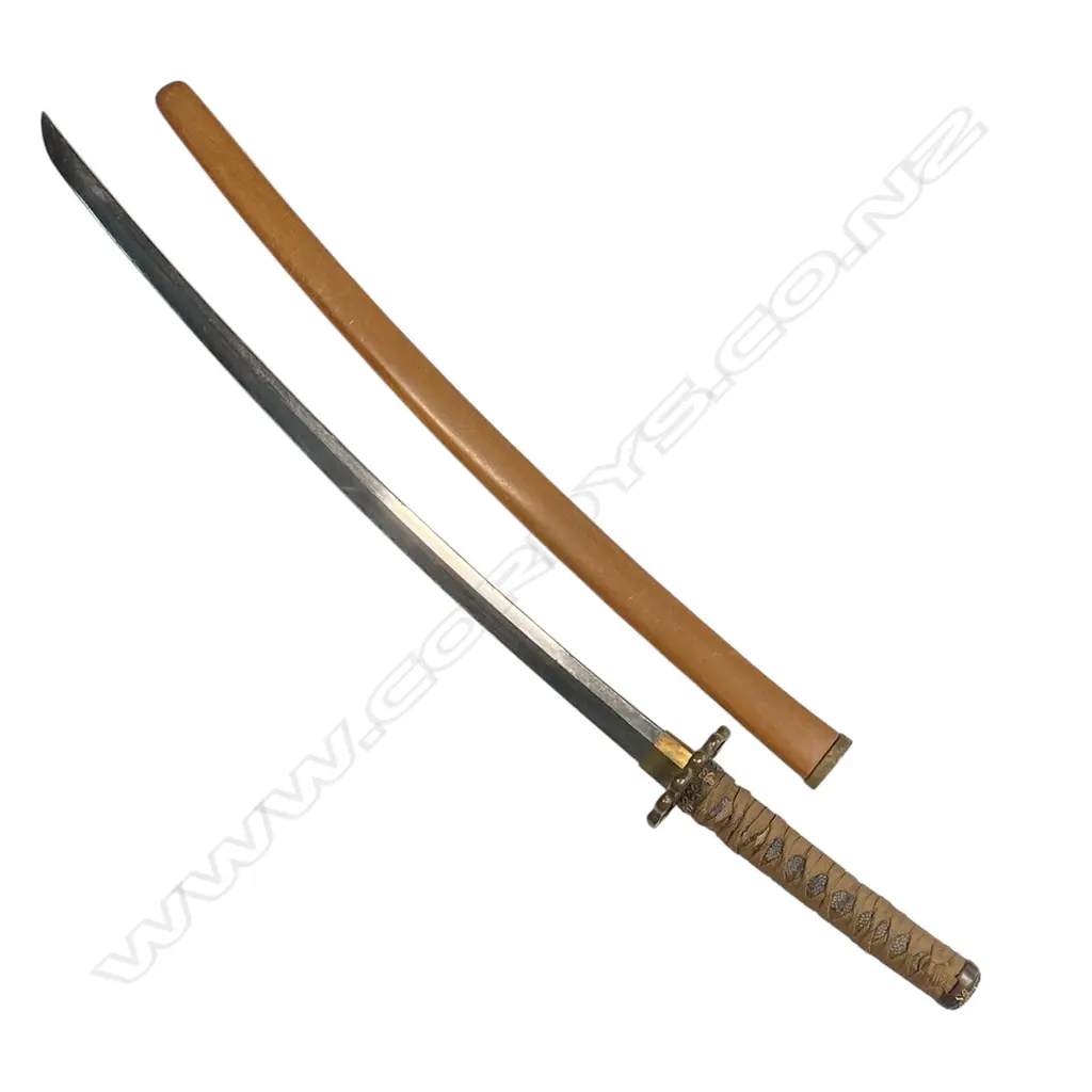 An uncommon small scale version of a Japanese katana, made for the Boy's Day ceremony - 455mm blade, the tang with two holes and threaded end; the hilt with correct scaled fittings and binding, in plain wood scabbard. Overall 630mm, Image 1++