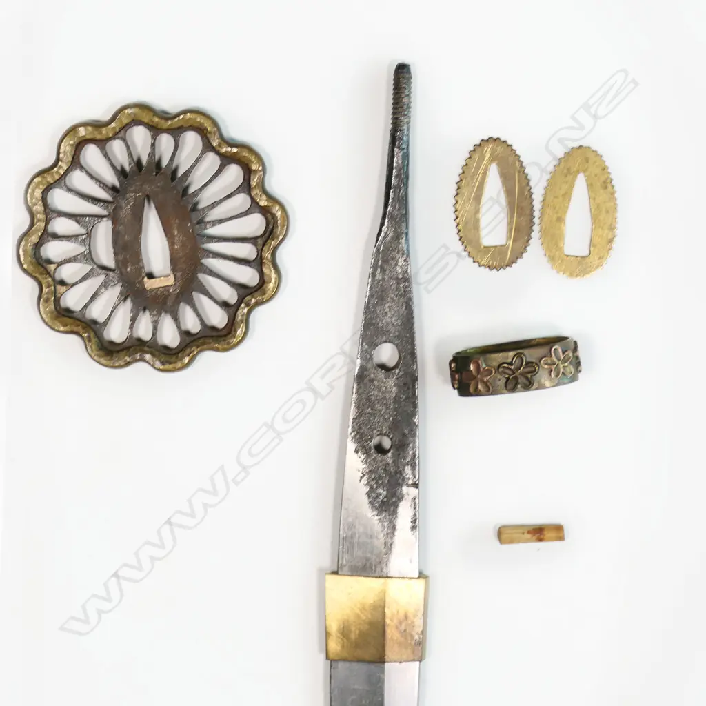 An uncommon small scale version of a Japanese katana, made for the Boy's Day ceremony - 455mm blade, the tang with two holes and threaded end; the hilt with correct scaled fittings and binding, in plain wood scabbard. Overall 630mm, Image 1++