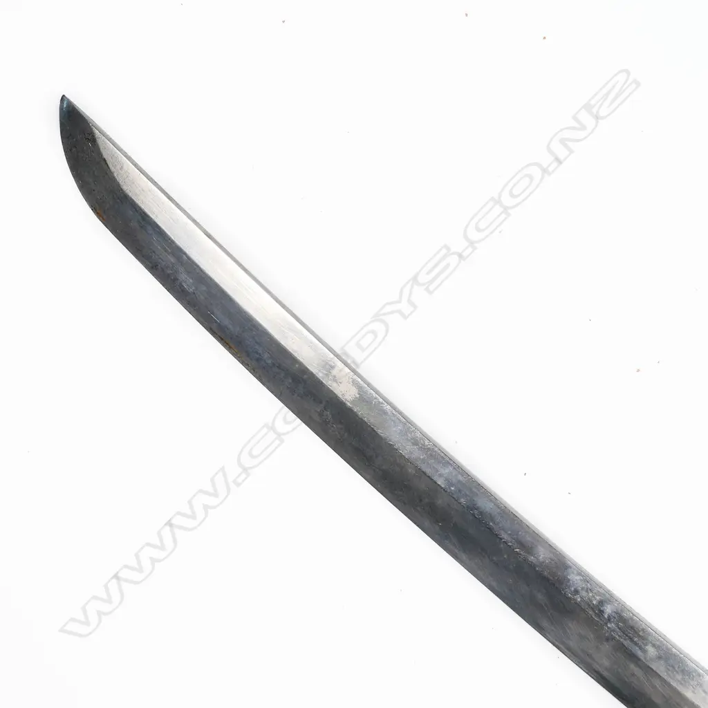 A Japanese katana - with cloth bound ray skin covered hilt with menuki, the tang with single fixing hole, tsuba with landscape decoration. Small area of pitting to blade and other slight oxidation. Blade L.710mm. Overall in lacquer scabbard with some faults 1050mm. Image 1++
