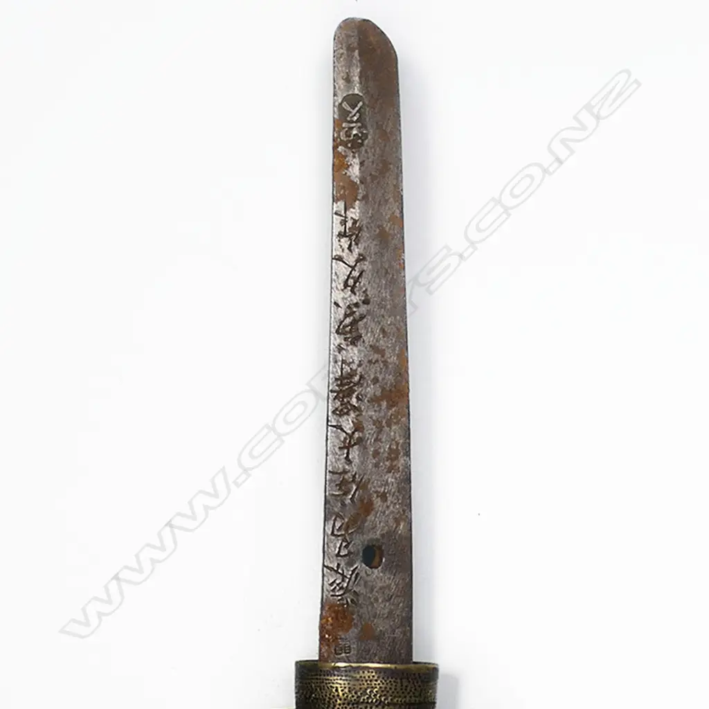 An old katana in tachi mounts (handachi - with cloth bound ray skin covered hilt with tachi kashira, chrysanthemum menuki, chrysanthemum decorated tsuba, the tang with incised and stamped characters, single fixing hole. Overall surface oxidation to blade, multiple nicks to blade edge. In plain wood saya with tachi style koshirae. Blade L.650mm. Overall 925mm. Image 1++