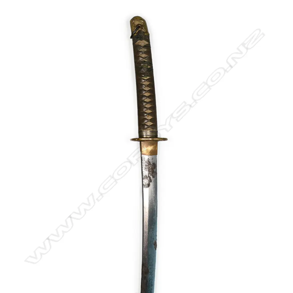 An old katana in tachi mounts (handachi - with cloth bound ray skin covered hilt with tachi kashira, chrysanthemum menuki, chrysanthemum decorated tsuba, the tang with incised and stamped characters, single fixing hole. Overall surface oxidation to blade, multiple nicks to blade edge. In plain wood saya with tachi style koshirae. Blade L.650mm. Overall 925mm. Image 1++