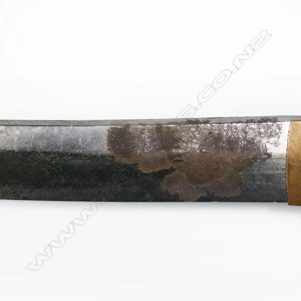 An old katana in tachi mounts (handachi - with cloth bound ray skin covered hilt with tachi kashira, chrysanthemum menuki, chrysanthemum decorated tsuba, the tang with incised and stamped characters, single fixing hole. Overall surface oxidation to blade, multiple nicks to blade edge. In plain wood saya with tachi style koshirae. Blade L.650mm. Overall 925mm. Image 1++