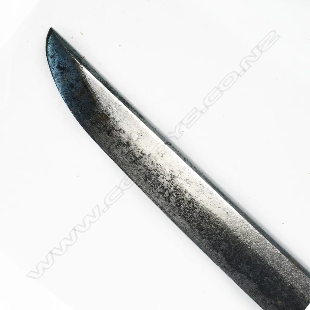 An old katana in tachi mounts (handachi - with cloth bound ray skin covered hilt with tachi kashira, chrysanthemum menuki, chrysanthemum decorated tsuba, the tang with incised and stamped characters, single fixing hole. Overall surface oxidation to blade, multiple nicks to blade edge. In plain wood saya with tachi style koshirae. Blade L.650mm. Overall 925mm. Image 1++