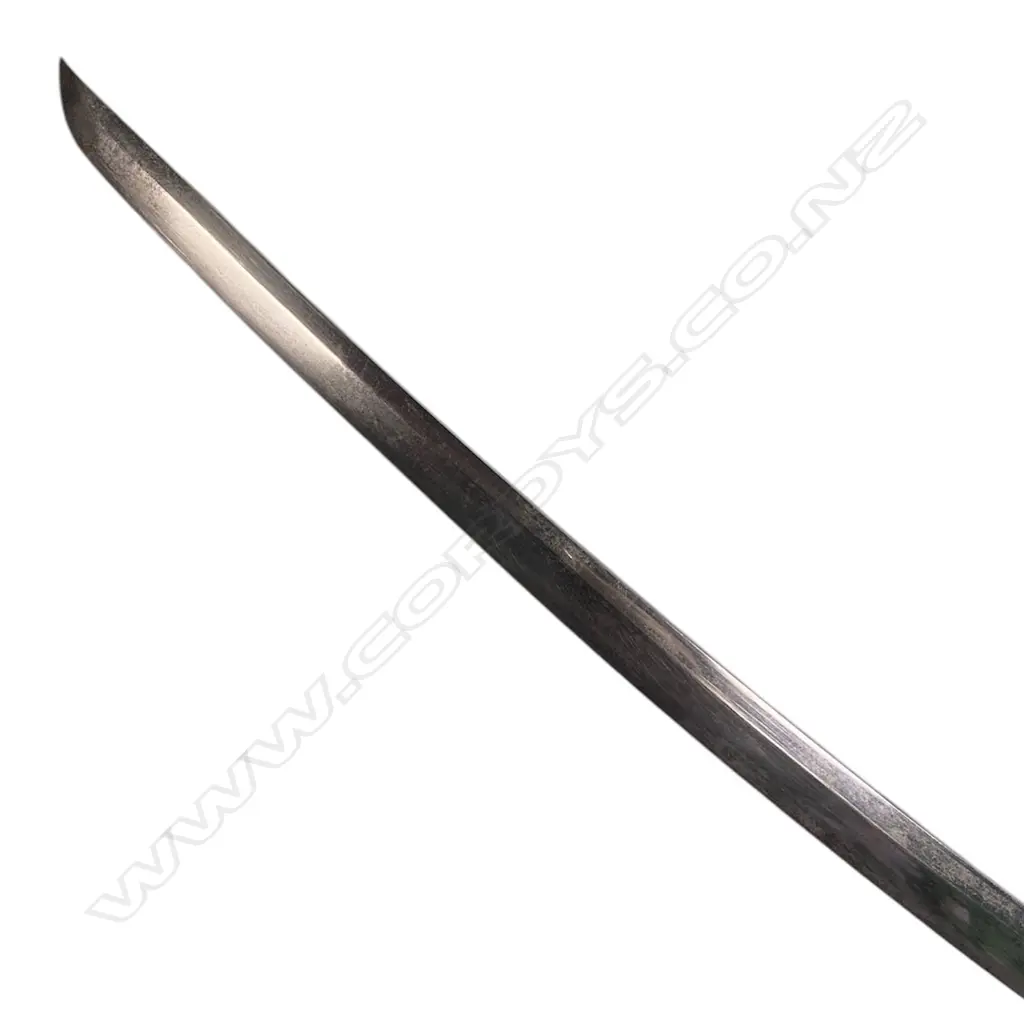 A Japanese katana blade in lacquer saya - L.610mm blade with few areas of surface oxidisation, unsigned tang with three fixing holes, hilt lacking all mounts except fuchi. Black saya with golden hatched pattern, a long bevel to one side revealing an alternate interior pattern. Overall in saya L.880mm, Image 1++