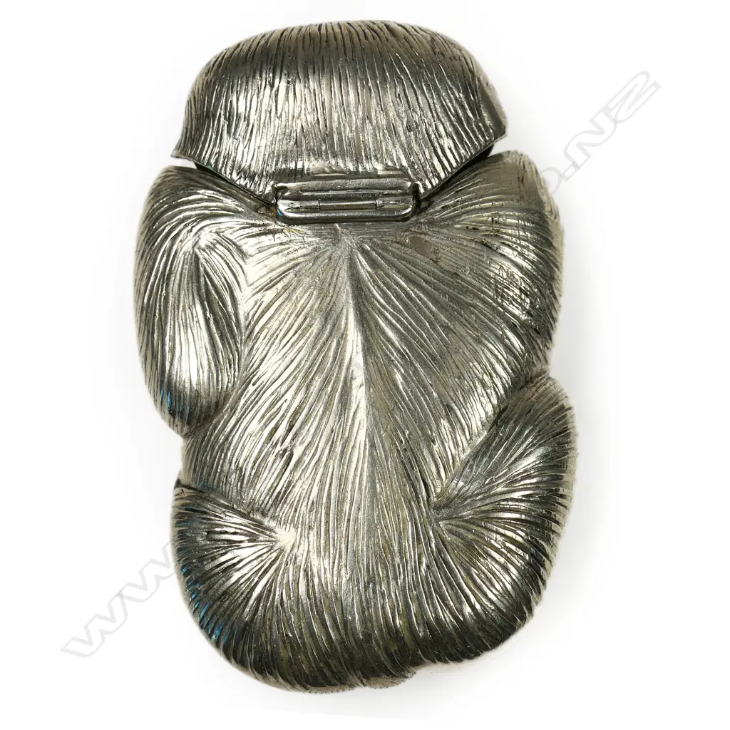 A c.1900 Japanese novelty white metal vesta case - as a monkey, its attention drawn to a bee on its leg. The bee and mouth highlighted in gilt and bronze overlay. H.65mm. Image 1++