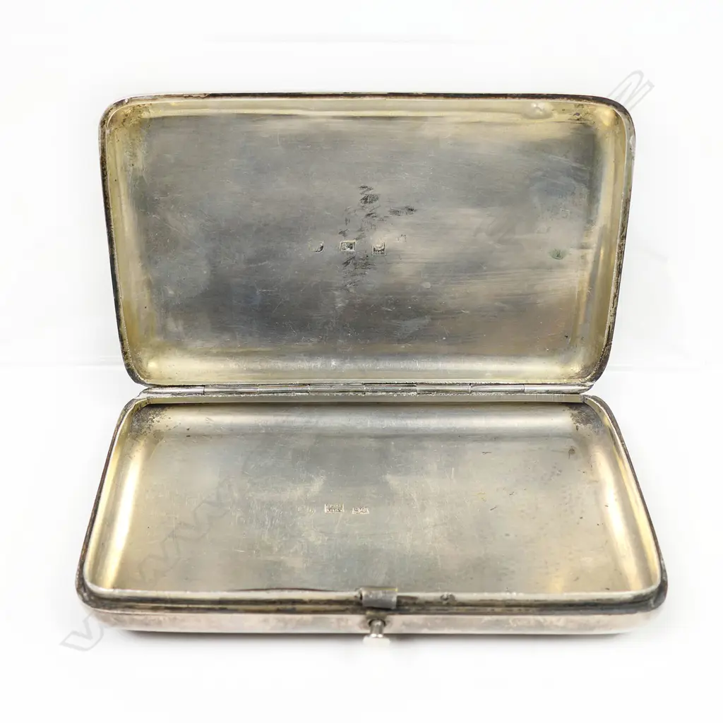 A 19thC Russian niello silver cigar case - finely decorated in a diaper pattern with floral border and framed cartouche. Push button release, the interior with marks for the maker Mikhail Foydorovich Sokolov and Moscow assay master's mark for Victor Vasilyevich Savinsky. 1867. W.120mm. 163gms. Image 1++