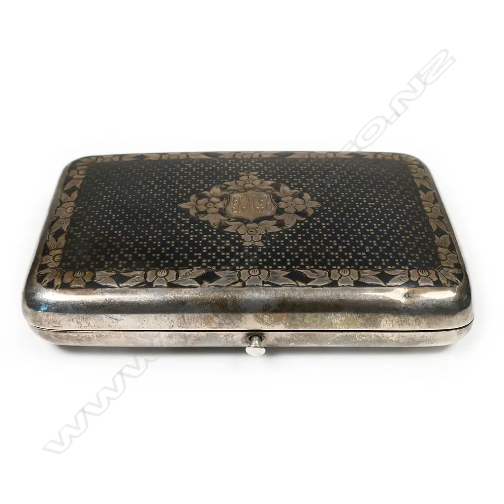 A 19thC Russian niello silver cigar case - finely decorated in a diaper pattern with floral border and framed cartouche. Push button release, the interior with marks for the maker Mikhail Foydorovich Sokolov and Moscow assay master's mark for Victor Vasilyevich Savinsky. 1867. W.120mm. 163gms. Image 1++