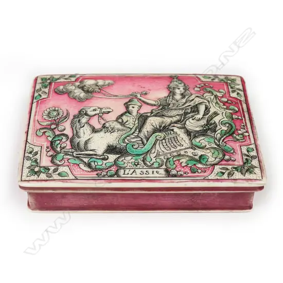 A French Lois XV painted Asian themed ivory gaming or card box - the lid with red and green stained incised scrimshaw like scene of a woman and attendant seated on a camel, entitled 'L'Assie' (Asia). The interior with decorative hinge and incised scene of a large rural building. The base with a heart decorated playing card. 80 x 60 x 15mm.