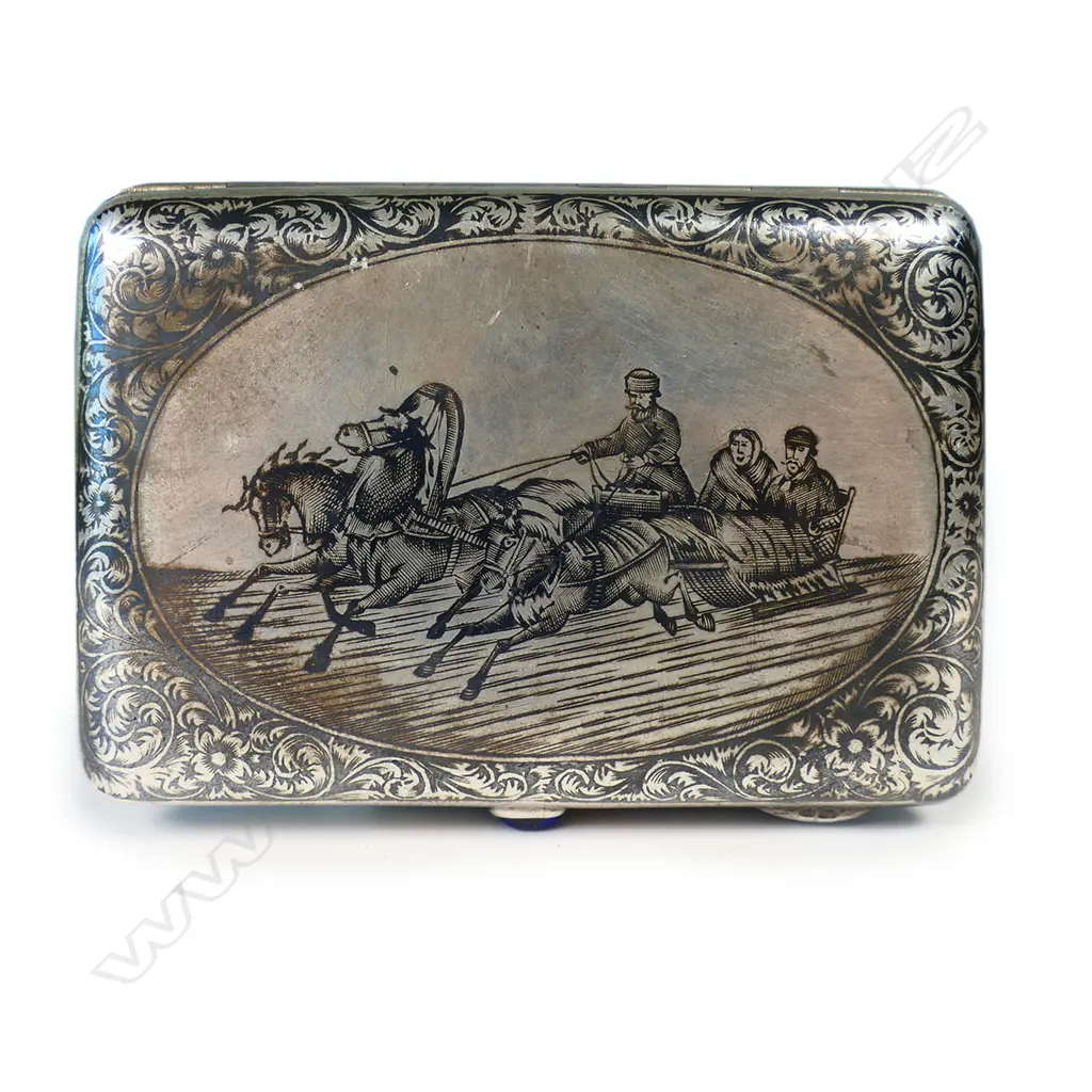 A 19thC Russian niello silver cigarette case - finely decorated with figures in horse drawn sliegh and leafy scrolls. Blue gem to the thumbpiece. Maker's mark for Pyotr Ambrosimov of Moscow 1869 - 1908. Image 1++