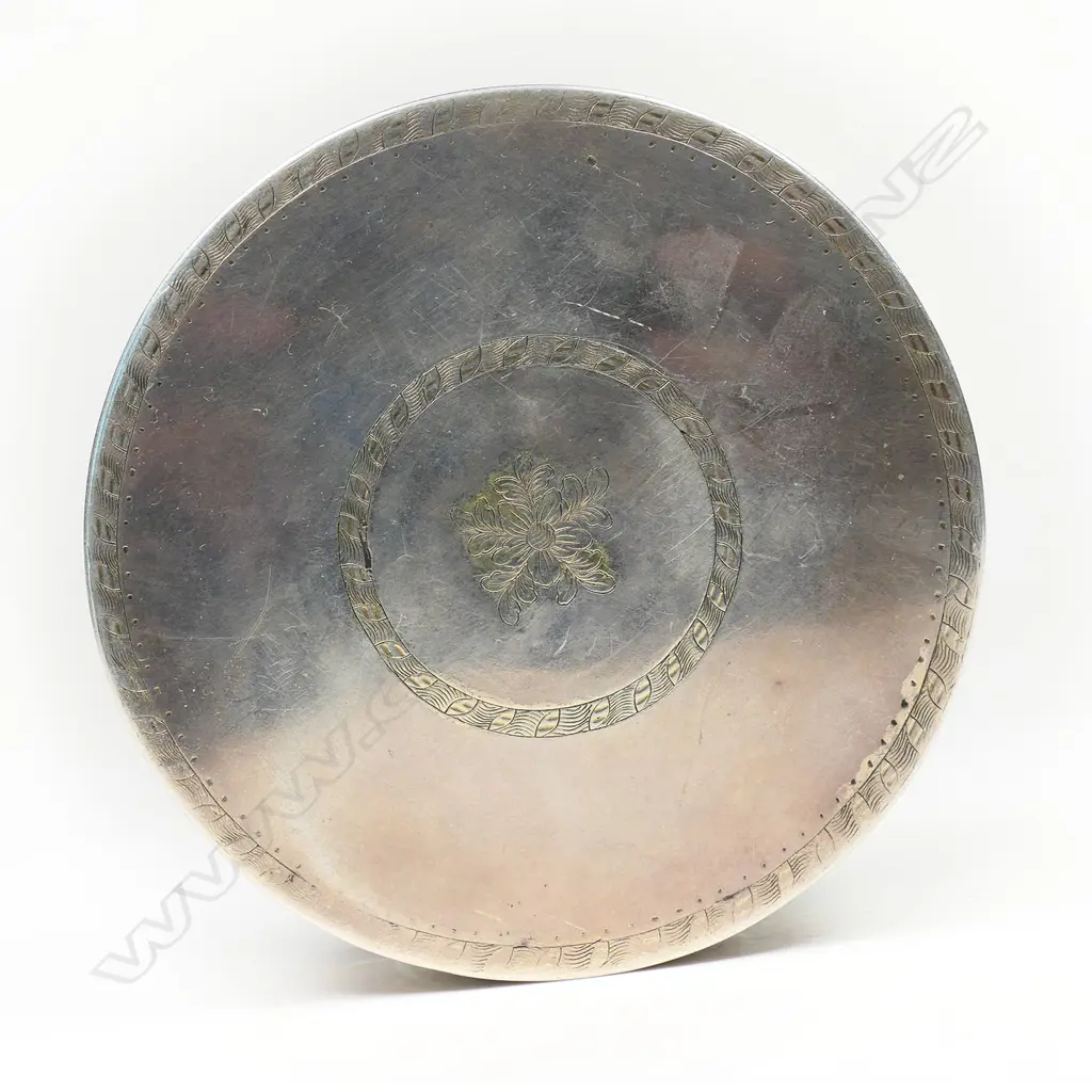 An 18thC Russian silver table box - the lid cast with a relief scene of two women in a treed landscape surrounded by cherubs. Fine engraved border bands. Stamped mark for 1786. Dia.90mm. 212gms. Image 1++