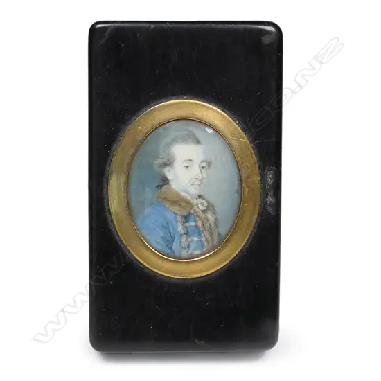 An 18thC European tortoiseshell snuff box set with a portrait miniature of a nobleman - the oblong box with loose lid (hinge absent) set with an oval gilt framed hand painted portrait under convex glass, of a gentleman in fur collared blue frock coat. Signed indistinctly right edge. 82 x 47 x 16mm,