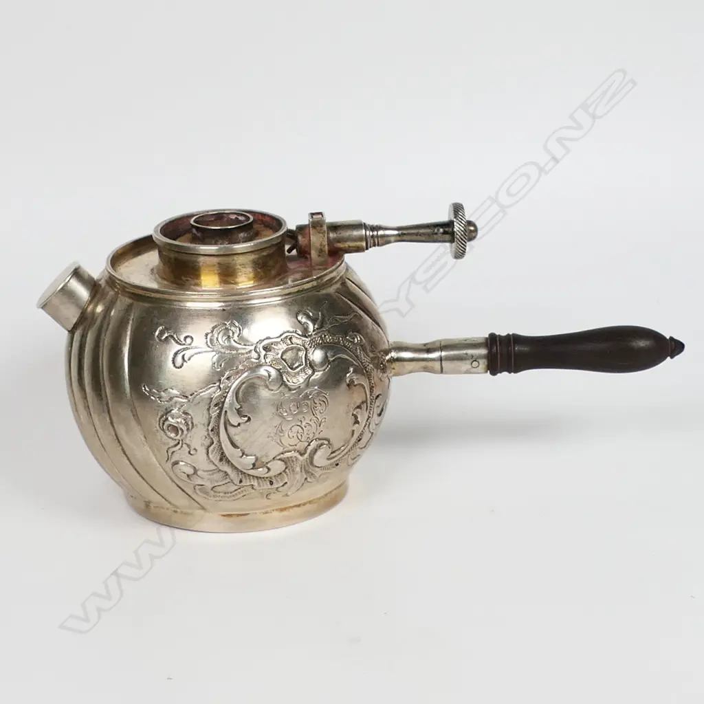 A 19thC European embossed silver table lighter - with floral and scroll framed cartouche and wrythen lobed spherical body. Adjustable wick and turned wood handle. Typically for lighting of cigars. H.65mm. Image 1++