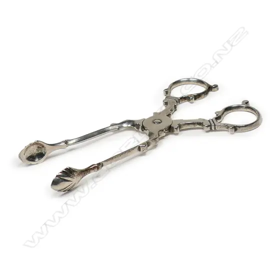 An Edwardian silver pair of Georgian style sugar scissor nips - shell bowls. London 1902 by William Hutton & Sons Ltd. 32gms.