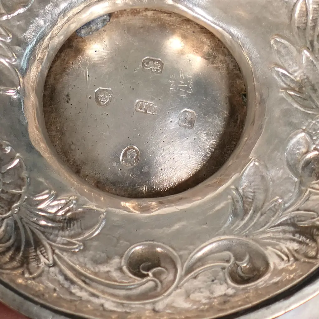 A William IV silver three-piece tea set, by Thomas Dick, London 1826 - compressed circular form raised on domed pedestal bases, chased and engraved with floral designs, the pot lid with floral finial. Total 1466gms. Image 1++