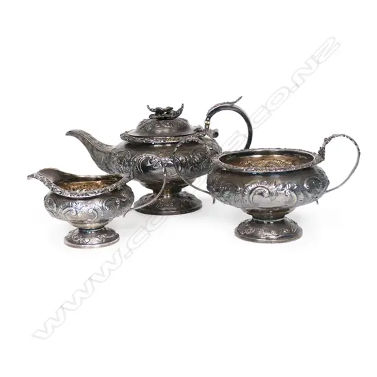 A William IV silver three-piece tea set, by Thomas Dick, London 1826 - compressed circular form raised on domed pedestal bases, chased and engraved with floral designs, the pot lid with floral finial. Total 1466gms.