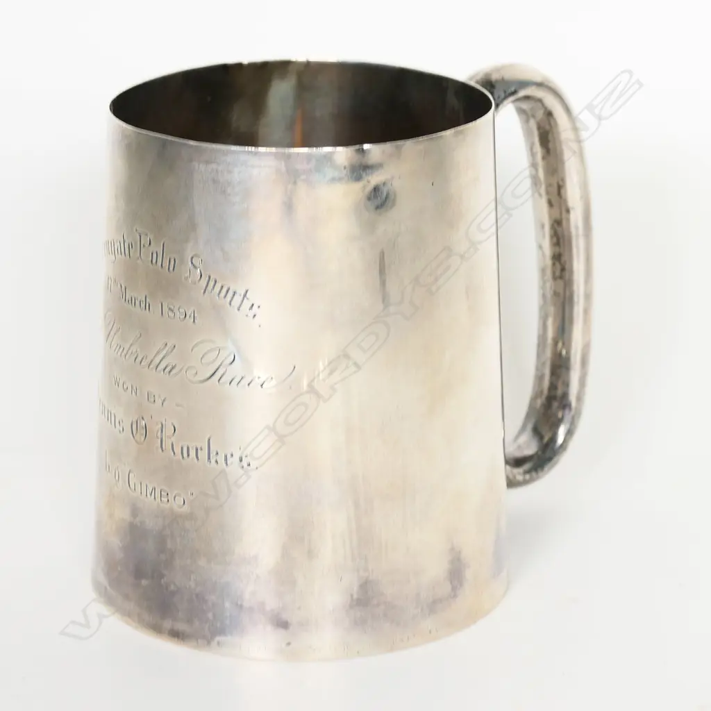 A 19thC New Zealand historical silver mug - presentation engraved 'Warrengate (Whanganui) Polo Sports 17th March 1894 Cigar & Umbrella Club Race Won by ...' Birmingham 1883 by W Spurrier & Co. H.105mm. 215gms. In original leather and gilded fitted case. Image 1++