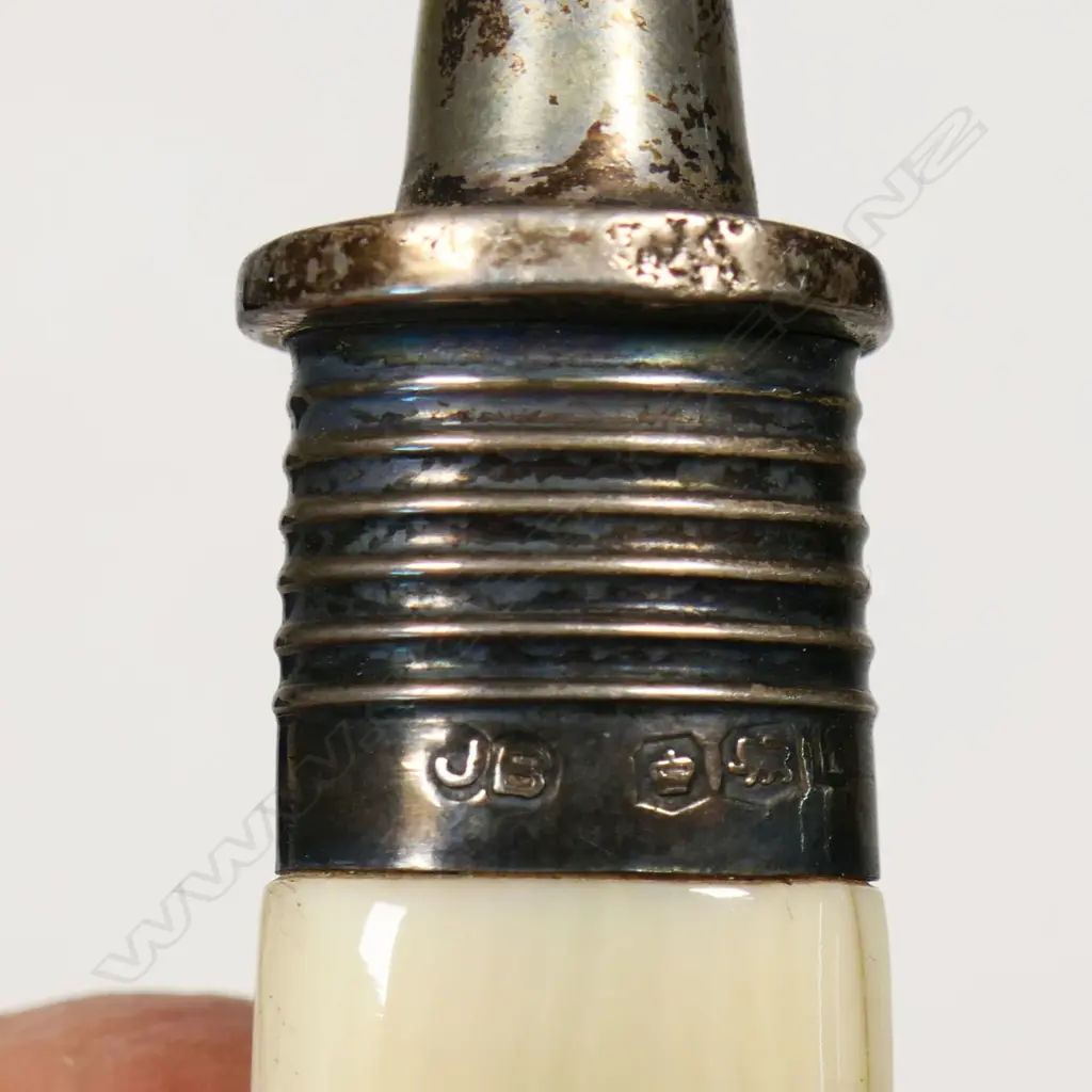 A cased presentation silver foundation laying trowel - engraved 'Presented to W.H. Ross Esq. On The Occasion Of Laying The Foundation Stone Of The St. Albans Presbyterian Church January 31st 1925’. Ivory handle. L.250mm. 96gms. In original leather fitted case. Image 1++