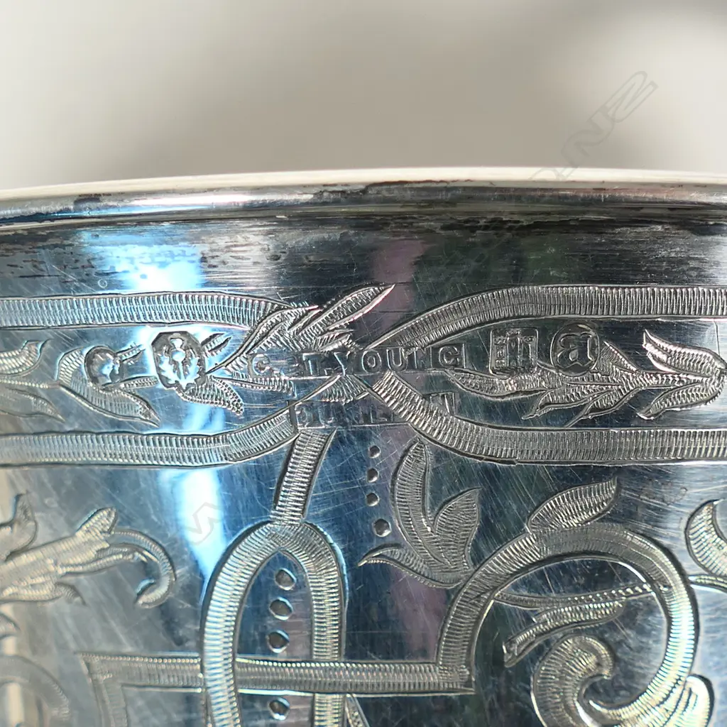 The New Zealand historic 1886 and 1890 silver 'Papakaio Ploughing Match' trophy cup - 'Won by AlexR. Hall'. Engraved to the reverse 'CUP For Champion Lot On Field to Be Won Twice by Same Competitor'. Large scrolling handles. Edinburgh 1882 for G & T Young Dunedin. H.325mm. 523gms. With stand. Image 1++