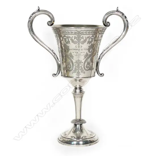 The New Zealand historic 1886 and 1890 silver 'Papakaio Ploughing Match' trophy cup - 'Won by AlexR. Hall'. Engraved to the reverse 'CUP For Champion Lot On Field to Be Won Twice by Same Competitor'. Large scrolling handles. Edinburgh 1882 for G & T Young Dunedin. H.325mm. 523gms. With stand.