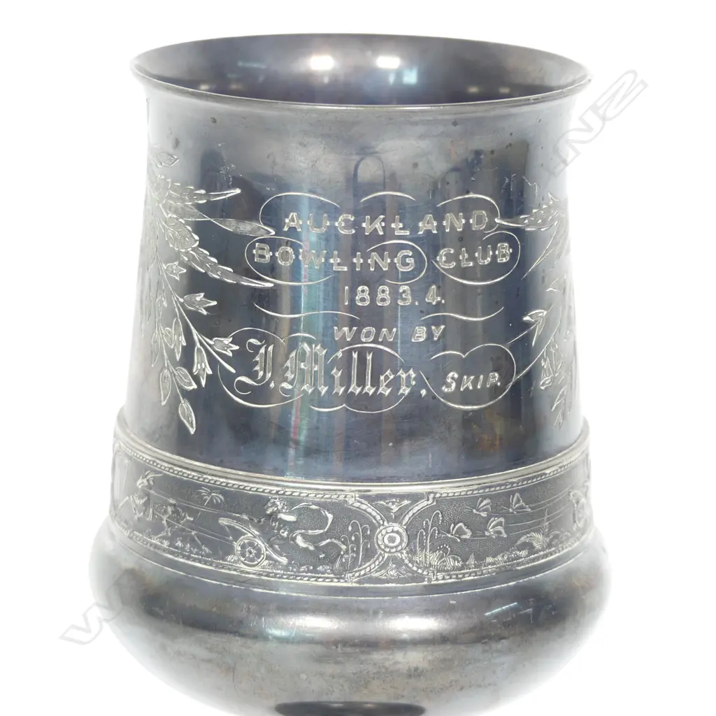 A late 19thC New Zealand historical silver plate trophy cup - presentation engraved ' Auckland Bowling Club 1883.4 Won By J Miller, Skip.'. The column support as a lyre. Tarnished. H.215mm. Image 1++