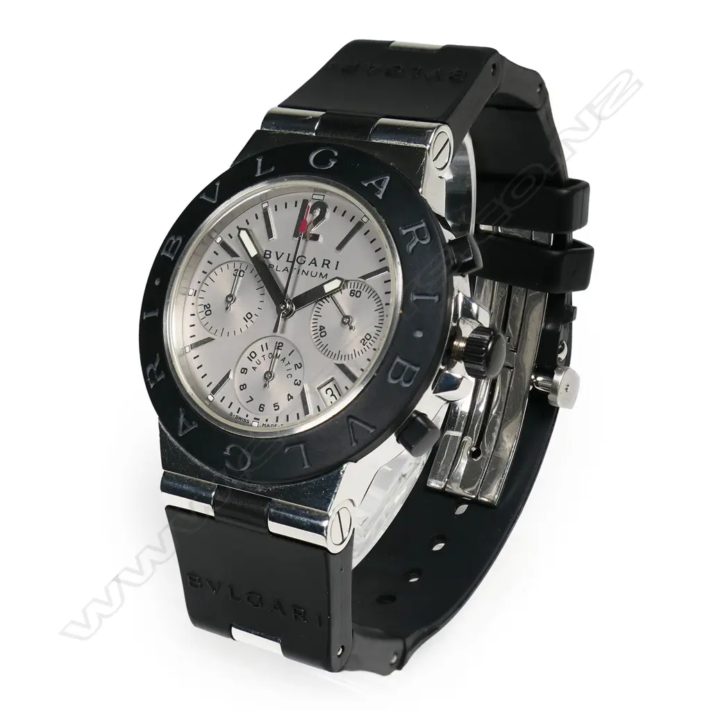 A Bvlgari platinum gent's chronograph wristwatch - automatic, silvered dial with three sub dials, date aperture, 22/99, rubber strap and bezel, Bvlgari mark to strap, bezel and back of case, the rubber strap has snapped, with Bvlgari bag. Purchased new by our vendor for HK$200,000 in 2003. Image 1++