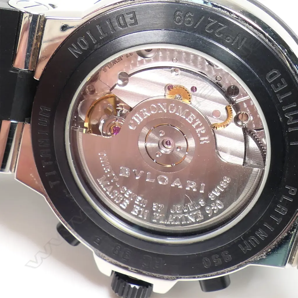 A Bvlgari platinum gent's chronograph wristwatch - automatic, silvered dial with three sub dials, date aperture, 22/99, rubber strap and bezel, Bvlgari mark to strap, bezel and back of case, the rubber strap has snapped, with Bvlgari bag. Purchased new by our vendor for HK$200,000 in 2003. Image 1++