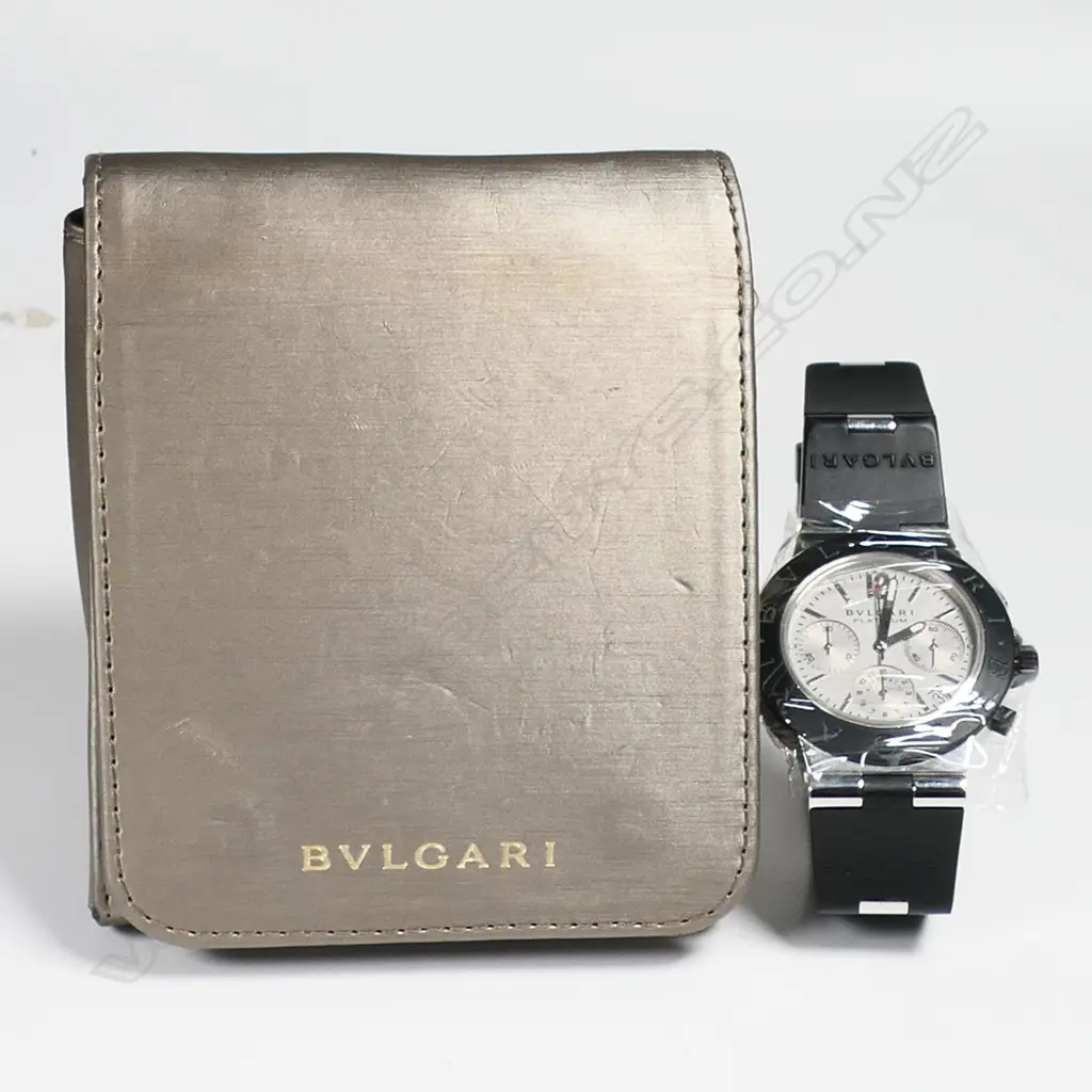 A Bvlgari platinum gent's chronograph wristwatch - automatic, silvered dial with three sub dials, date aperture, 22/99, rubber strap and bezel, Bvlgari mark to strap, bezel and back of case, the rubber strap has snapped, with Bvlgari bag. Purchased new by our vendor for HK$200,000 in 2003. Image 1++