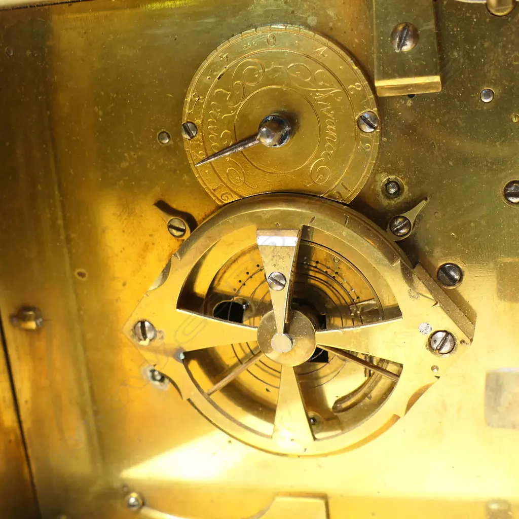 A 19thC brass cased alarm striking lantern clock - the over-head bell supported by four brass cross-over straps secured by the corner finials, convex white enamel dial with Roman numerals. Running, alarm requiring attention. H.150mm. Image 1++