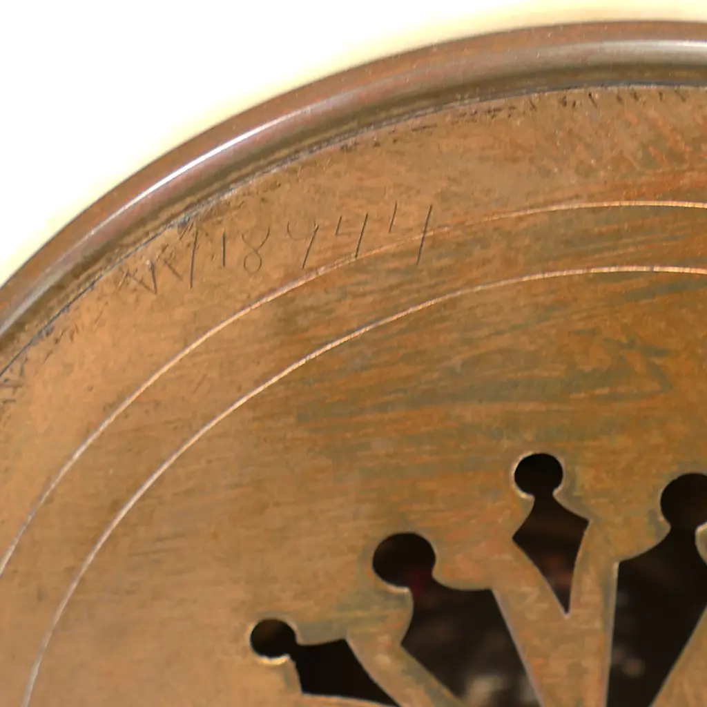 A Louis Phillipe period French marble and ormolu cased three-piece clock garniture - the clock with bell striking movement in a cream marble drum case supported by ormolu putto and surmounted by a military trophy; raised on a plateau with further gilt bronze embellishment. With a pair of associated urn-candlesticks with ram's head handles and with reversible candlestick nozzles/knopped finials. Clock H.350mm, Image 1++