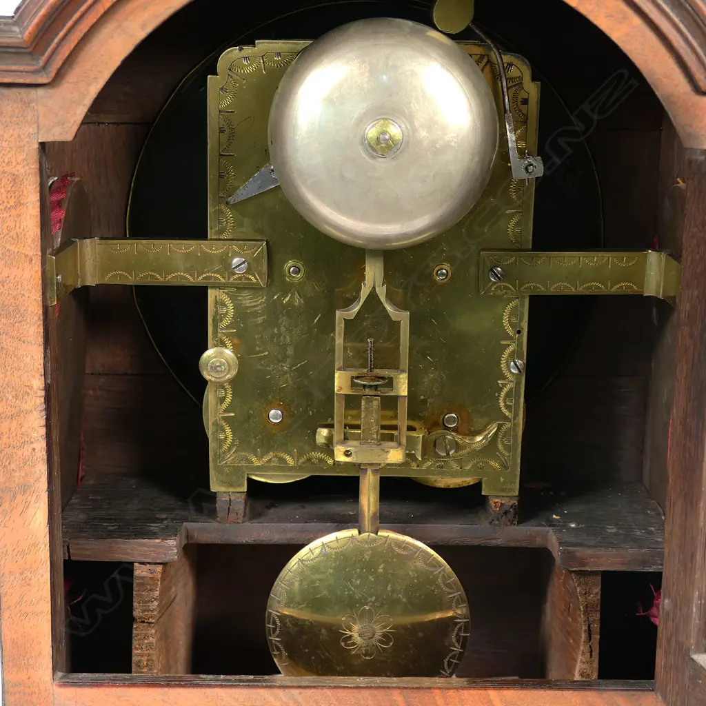 A late 18th century mahogany bracket clock by George Mackie & Son, City Road, London - with 8-day twin-fusee, engraved movement, striking the hours on a bell, pendulum lock screw absent, with winding and door keys. The case of break arch form with carry handle, with circular convex repainted dial, with Arabic numerals, original brass scale fretwork to lower quarters and the sides, arched glazed door to rear, standing on brass ogee bracket feet. H.395mm, Image 1++