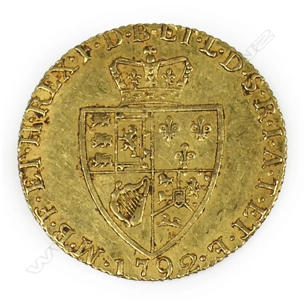 A 1792 gold spade guinea - 22ct gold, 8.4gms. Dia.24 mm. The reverse with crowned quartered shield of arms in the shape of a spade, legend around, date 1792 below. A good example. Image 1++