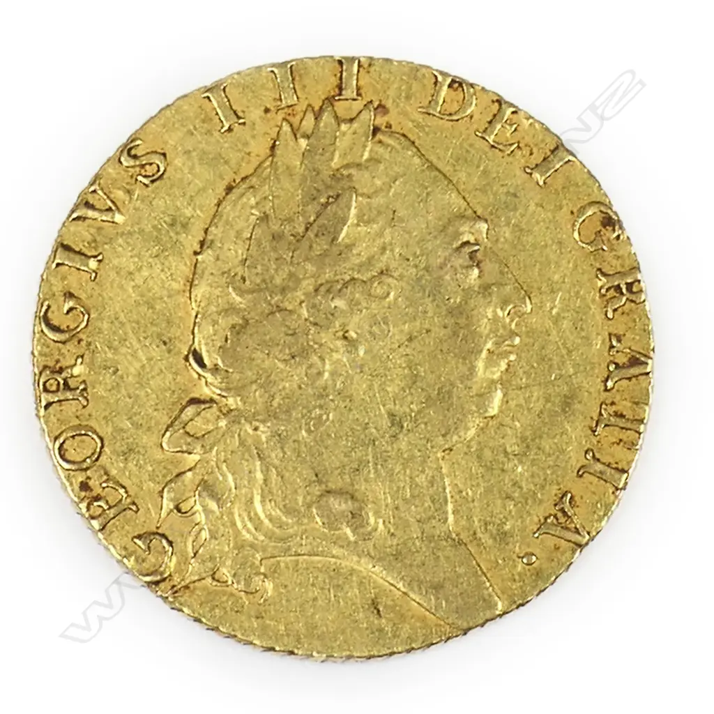 A 1792 gold spade guinea - 22ct gold, 8.4gms. Dia.24 mm. The reverse with crowned quartered shield of arms in the shape of a spade, legend around, date 1792 below. A good example. Image 1++